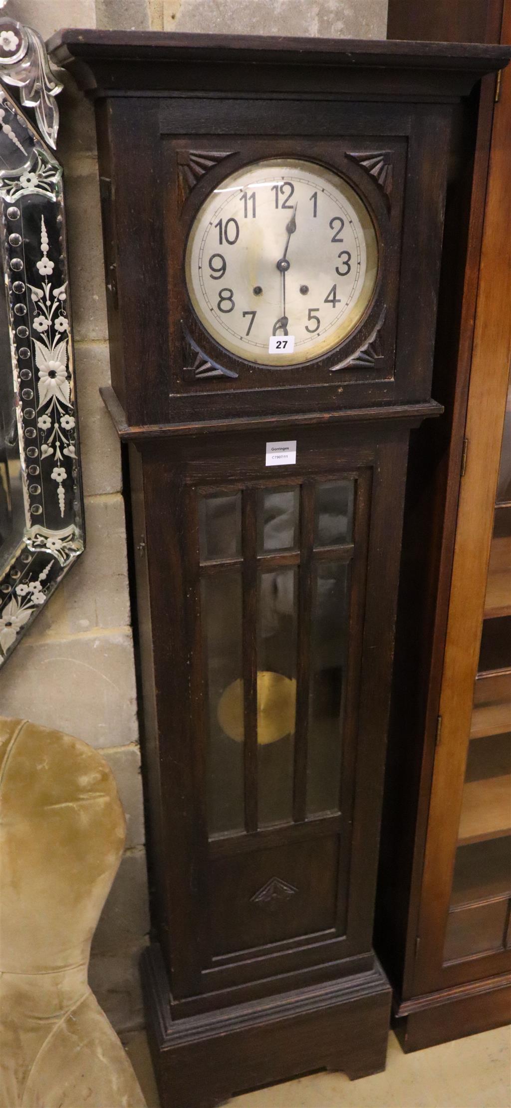 A 1930s oak cased eight day striking longcase clock, 173cm high